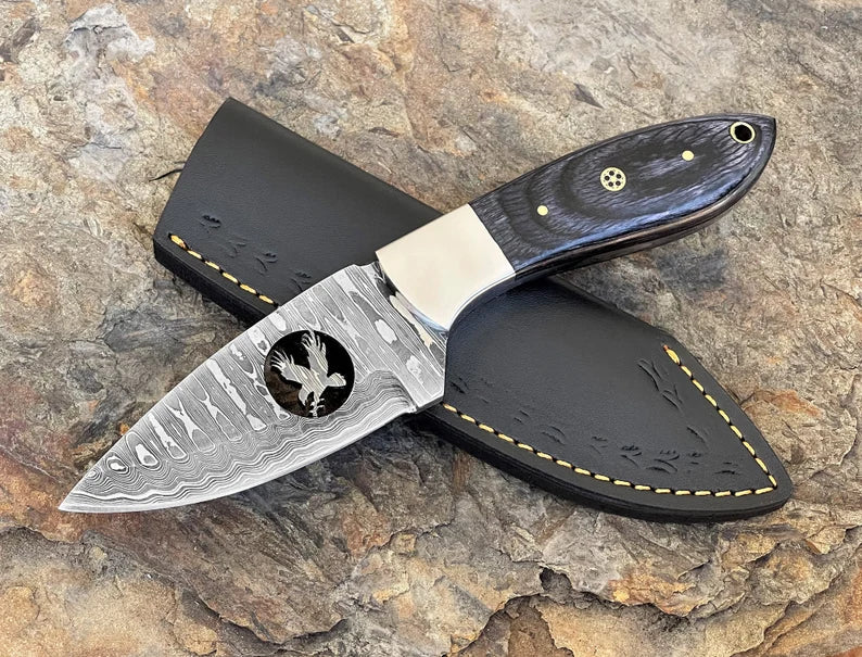 8" Damascus steel fixed blade knife with Black Pakka wood handle.