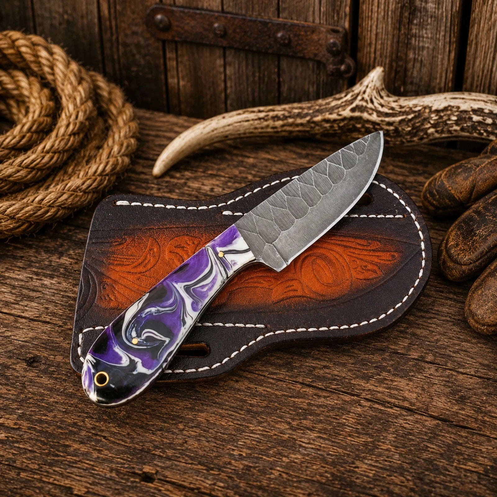 Amethyst Buckaroo Skinner Knife – Acid Wash D2 Steel & Purple Resin Handle - SHAM KNIVESCowboy KnifeSHAM KNIVESPurple resin handle hunting knife with handcrafted leather scout sheath.