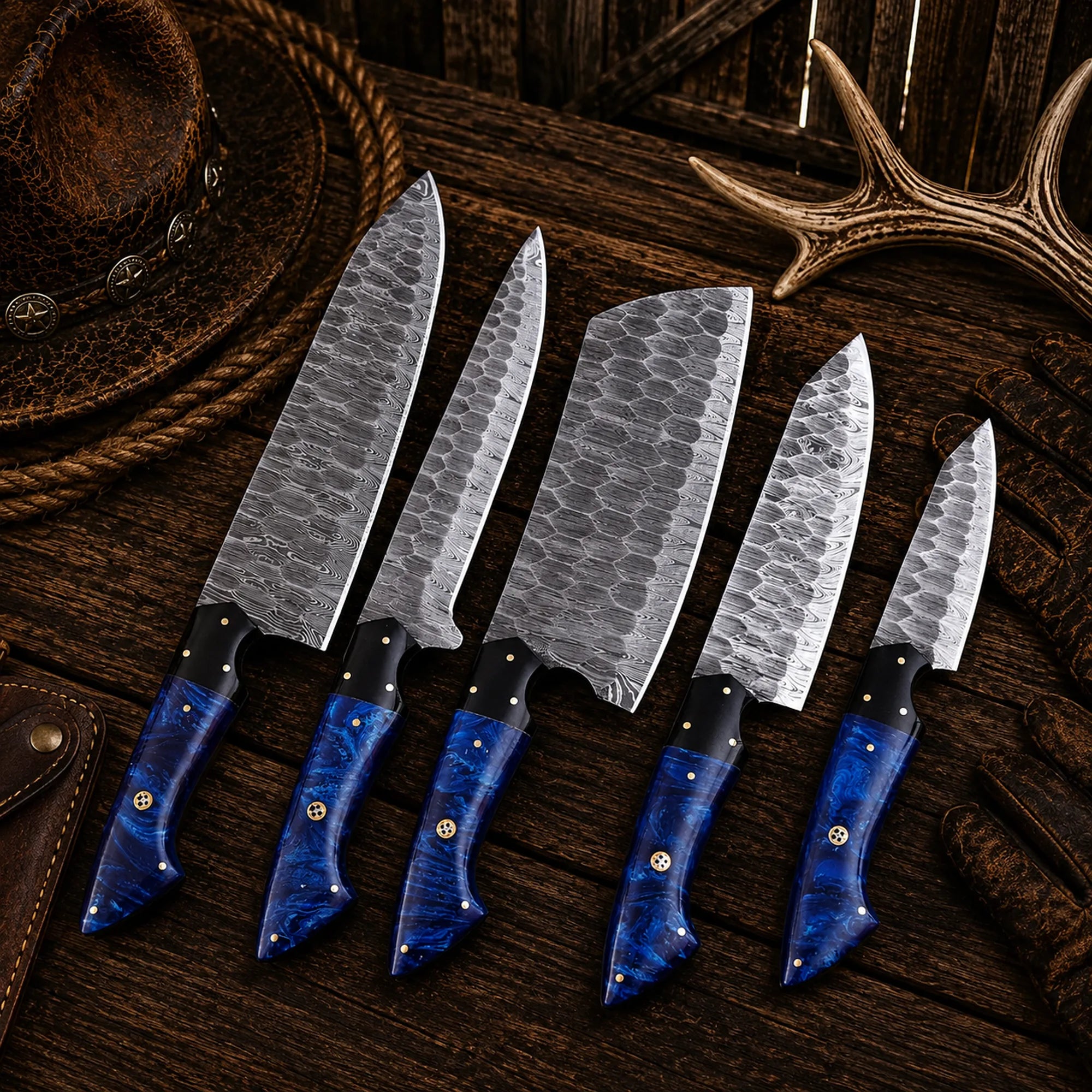 Professional Damascus chef knife set featuring blue resin handles.