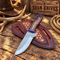 Blue Pine Cone Cowboy Skinning Knife – Rasp Steel & Pancake Sheath - SHAM KNIVESSkinning KnifeSHAM KNIVESCowboy skinning knife displayed with pancake leather belt sheath