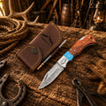 Cowboy Champion Damascus folding pocket knife with turquoise and wood handle with leather sheath.