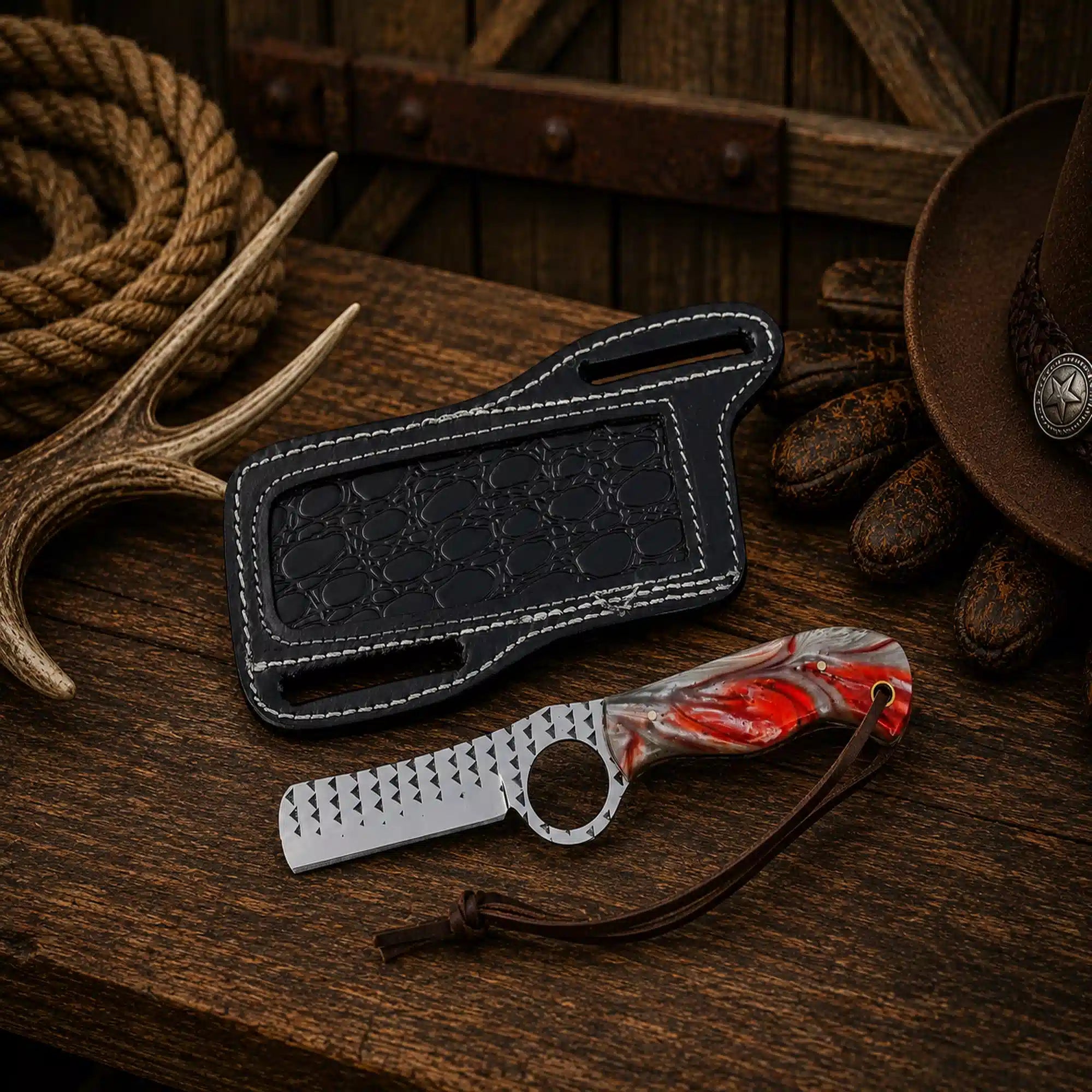 Artisan-crafted Cowboy Bull Cutter Knife with a polished Rasp Steel blade, custom red resin handle, and premium leather pancake sheath.