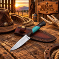 D2 steel cowboy skinner knife with a wood and turquoise handle beside a brown leather sheath
