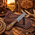 Damascus ranch cowboy knife with pinecone handle on a tooled leather sheath
