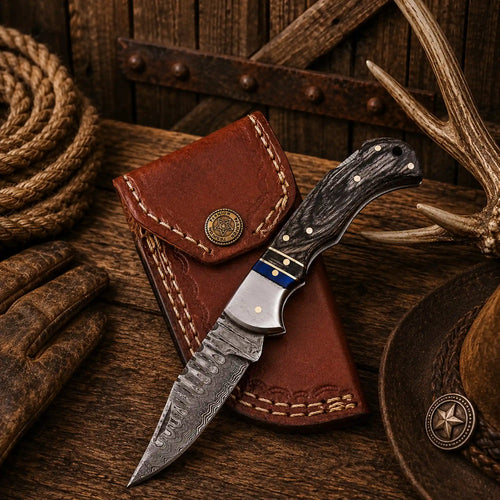 Handmade 6.5-inch Damascus steel folding pocket knife with black Pakka wood handle, steel bolster, back lock, and premium leather sheath.