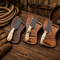 Dutton Ranch Collection for Sale – D2 Powder Coated Cowboy Carry Knives - SHAM KNIVESCowboy KnifeSHAM KNIVESDutton Ranch Collection handmade cowboy knives with D2 powder coated blades and ram horn handles back belt sheath.
