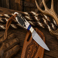 Handmade Elk Ridge Buckaroo Knife with D2 steel blade and antler horn handle floral leather pancake belt sheath.