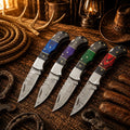 Handmade Cowboy Damascus pocket knife collection with colorful Pakka wood handles with leather sheaths