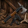 Premium Damascus steel Viking axe with hardwood handle and black leather grip.