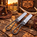 Iron Horse railroad spike bull cutter knife pair on a rustic wooden table
