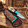 Mini skinning knife displayed with decorative pancake belt sheath