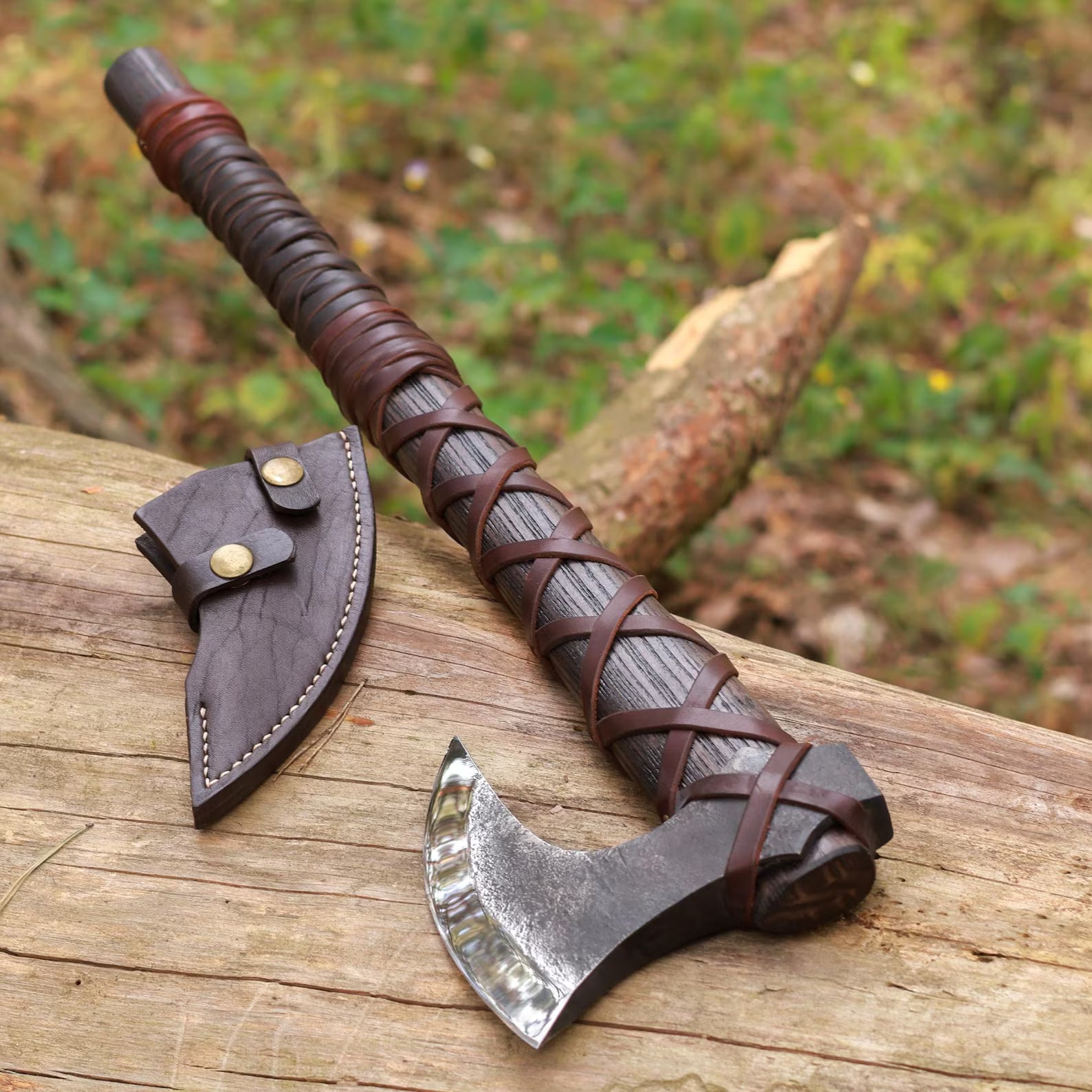 Ragnar Viking axe hand forged steel blade with leather sheath rustic barn background