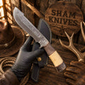 Trailing Point Black Widow Bowie with Damascus blade and colored-bone handle
