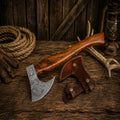 Handmade Viking style Damascus steel axe with rosewood handle and leather sheath.