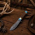 Handmade Western Cowboy Hunting Knife with a 5-inch Fire Damascus blade, natural stag antler handle, turquoise inlay, and hand-stitched leather sheath.