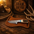 Working cowboy belt knife with 3.25-inch raindrop Damascus steel blade